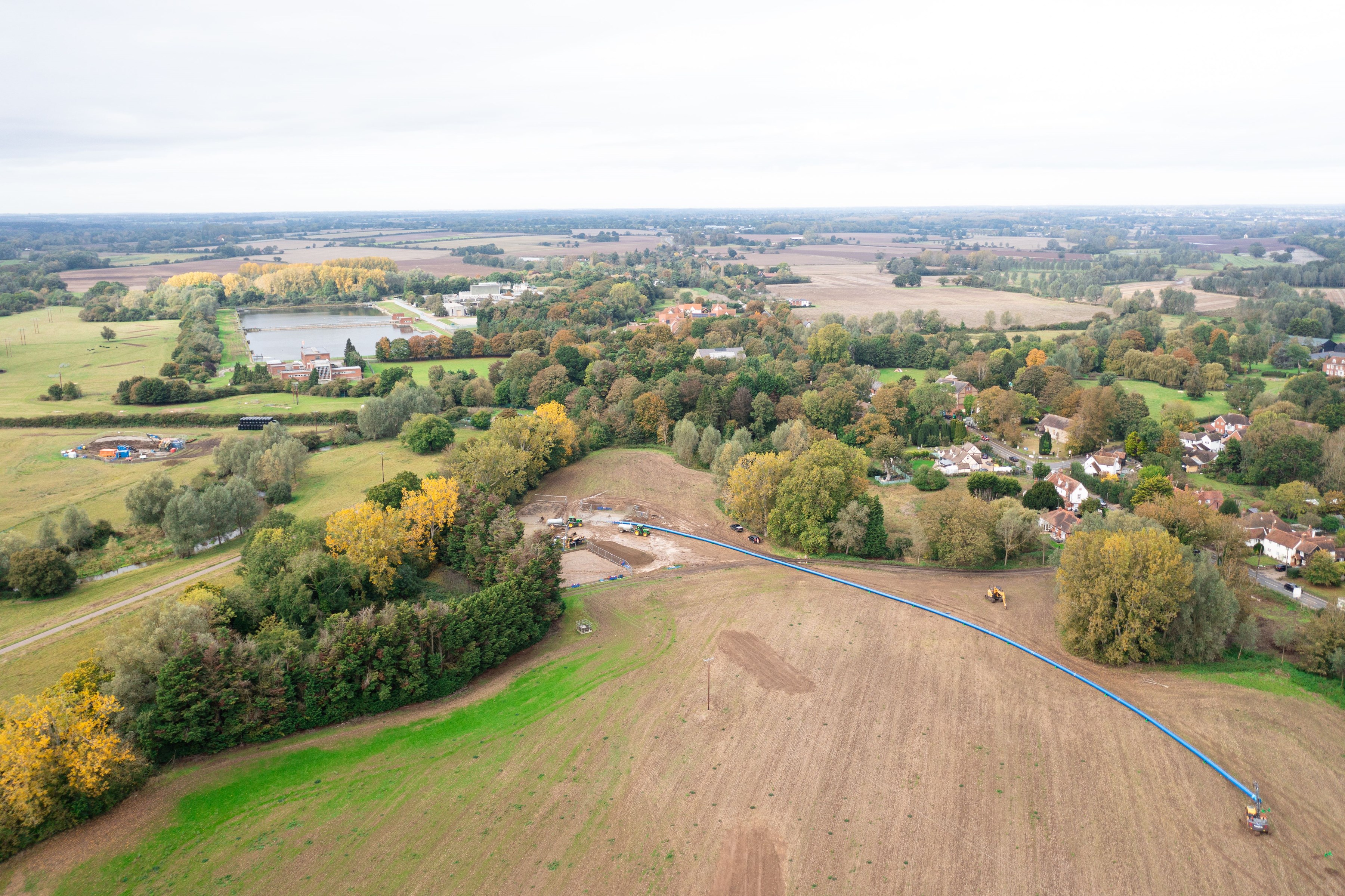 Open field with a town beyond